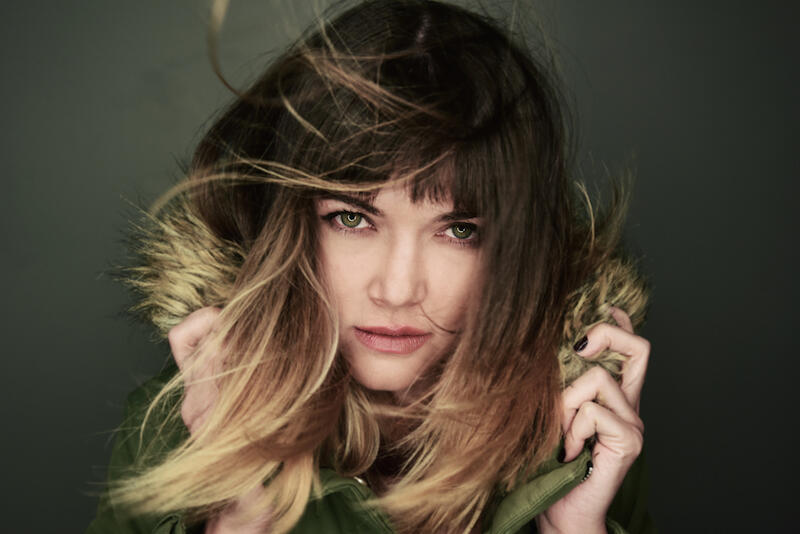 A close-up of the singer Maia Vidal looking at camera